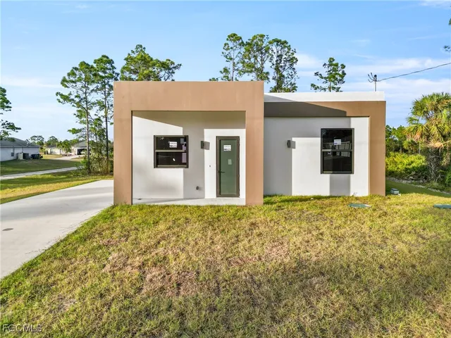 front view of a house with a yard