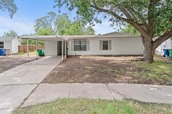 front view of a house with a garden