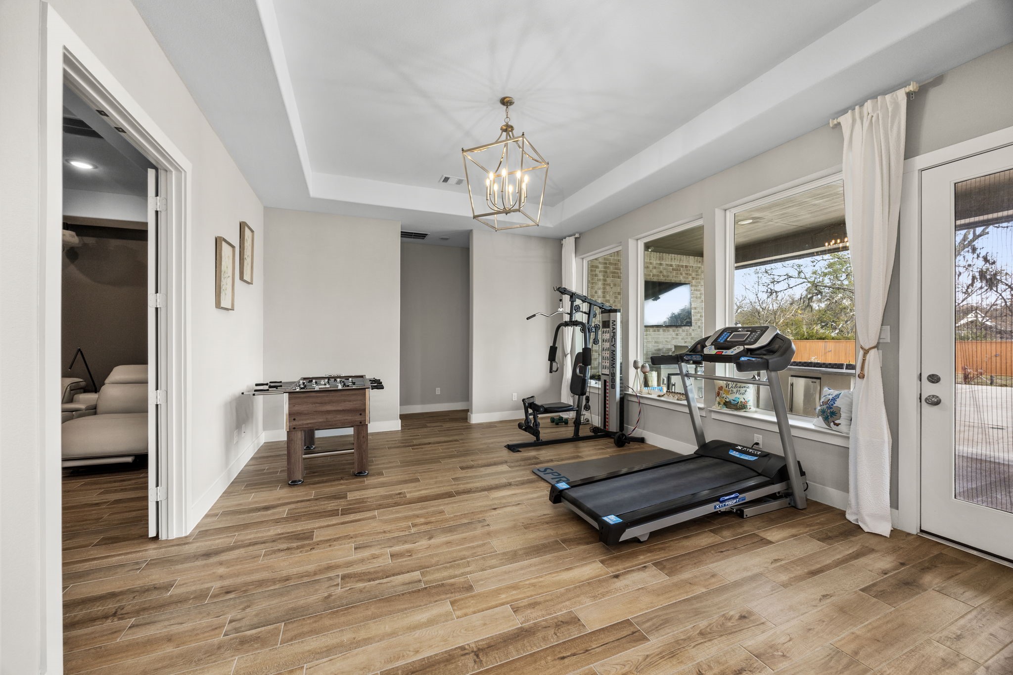 29402 Cir S Rnch Trail Fulshear, TX 77406 - Photo 22 of 50 a living room with furniture a dining table and a chandelier