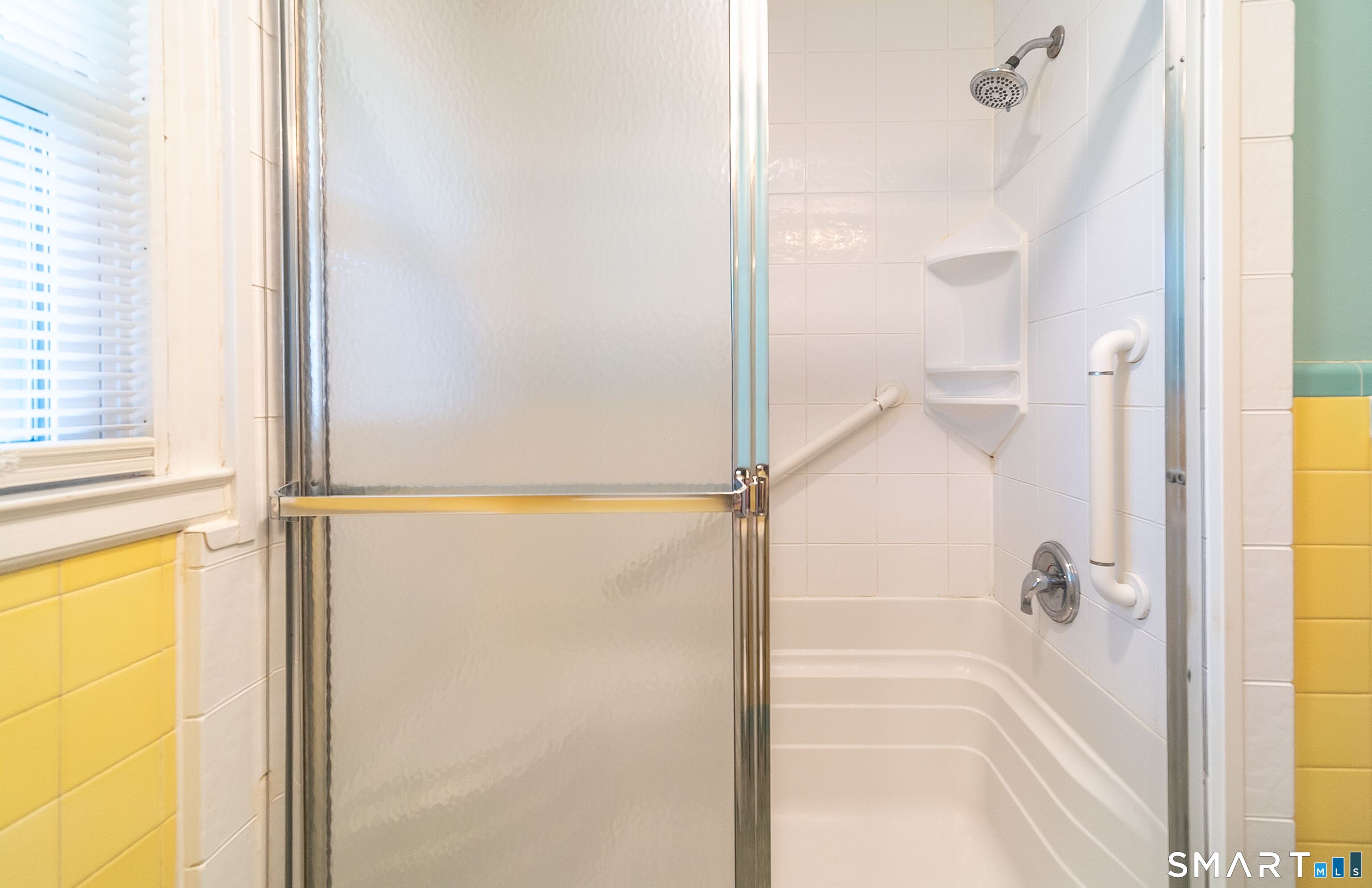 16 Featherbed Lane Branford, CT 06405 - Photo 18 of 40 a bathroom with a glass shower door