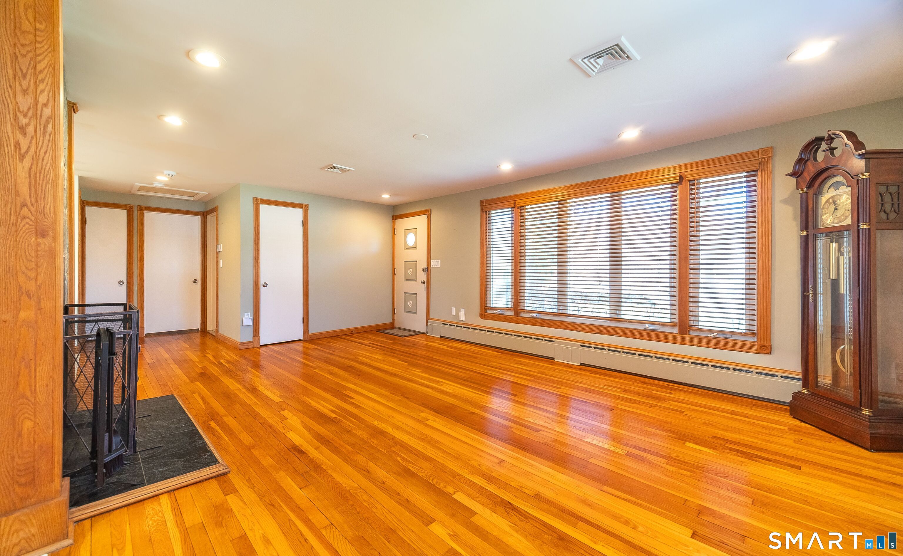 16 Featherbed Lane Branford, CT 06405 - Photo 2 of 40 a view of an empty room with window and a kitchen