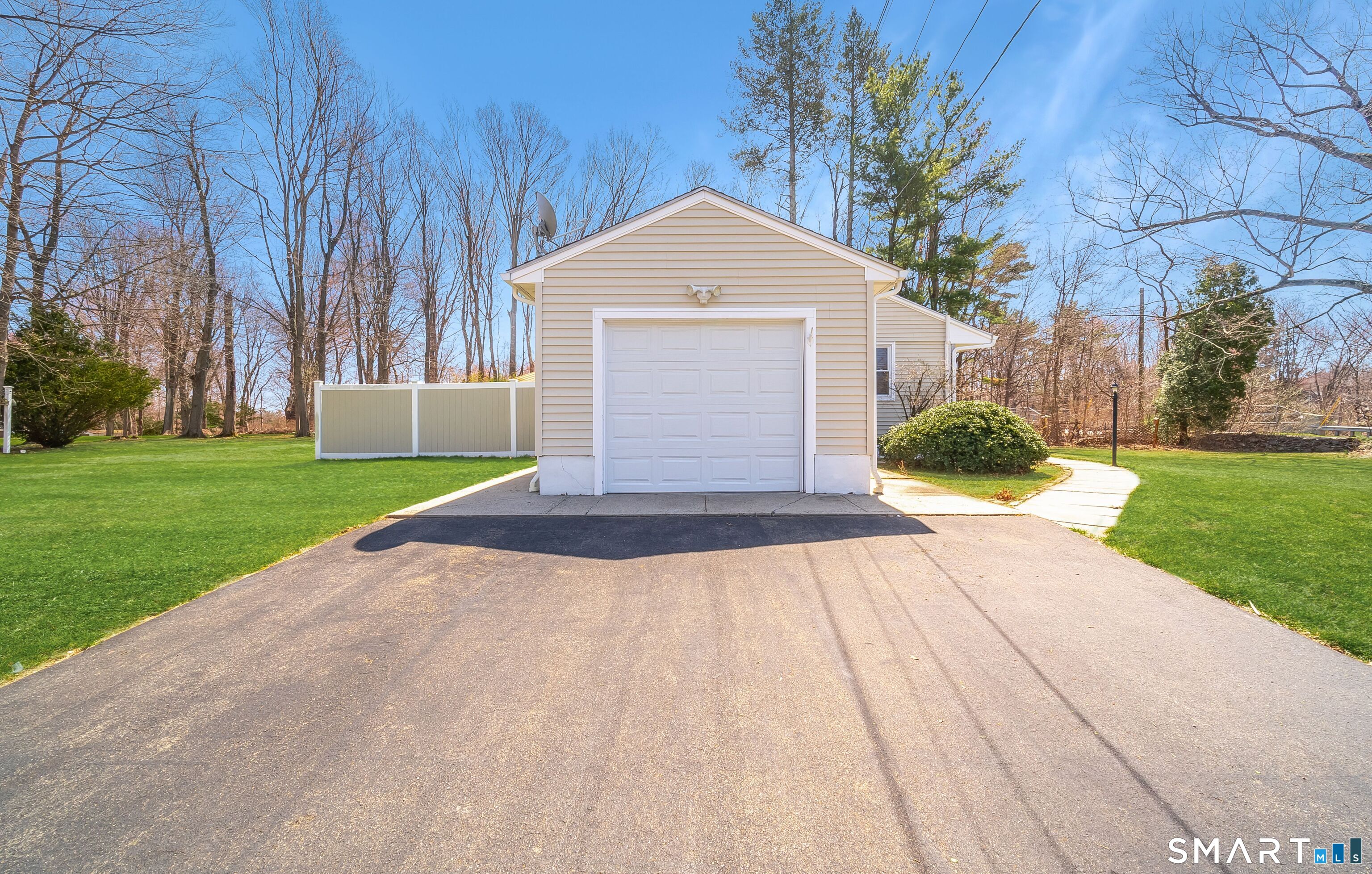 16 Featherbed Lane Branford, CT 06405 - Photo 33 of 40 a front view of a house with a yard and garage