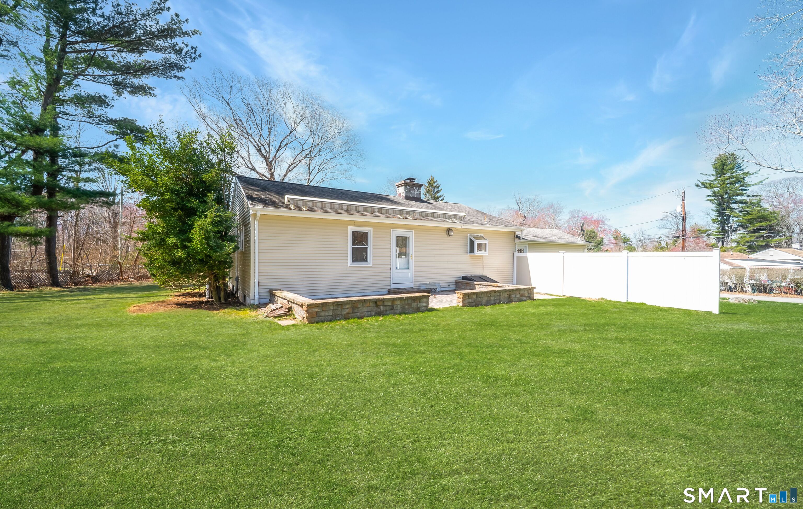 16 Featherbed Lane Branford, CT 06405 - Photo 35 of 40 a view of a backyard with plants and a garden
