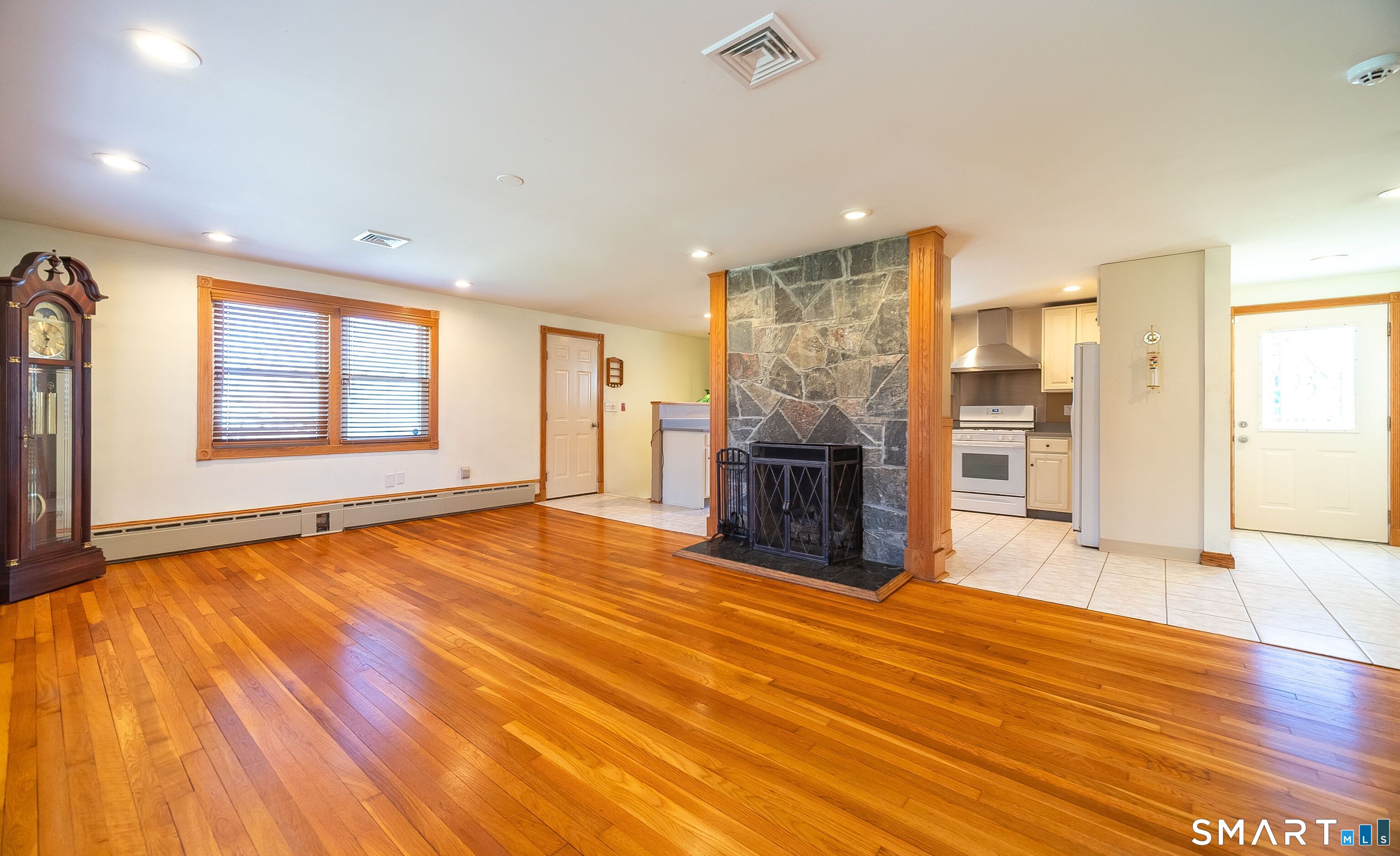 16 Featherbed Lane Branford, CT 06405 - Photo 4 of 40 a view of an empty room with window and wooden floor
