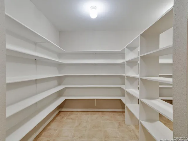 a view of an empty walk in closet
