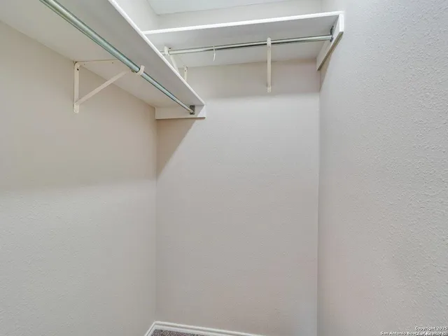 a view of an empty walk in closet