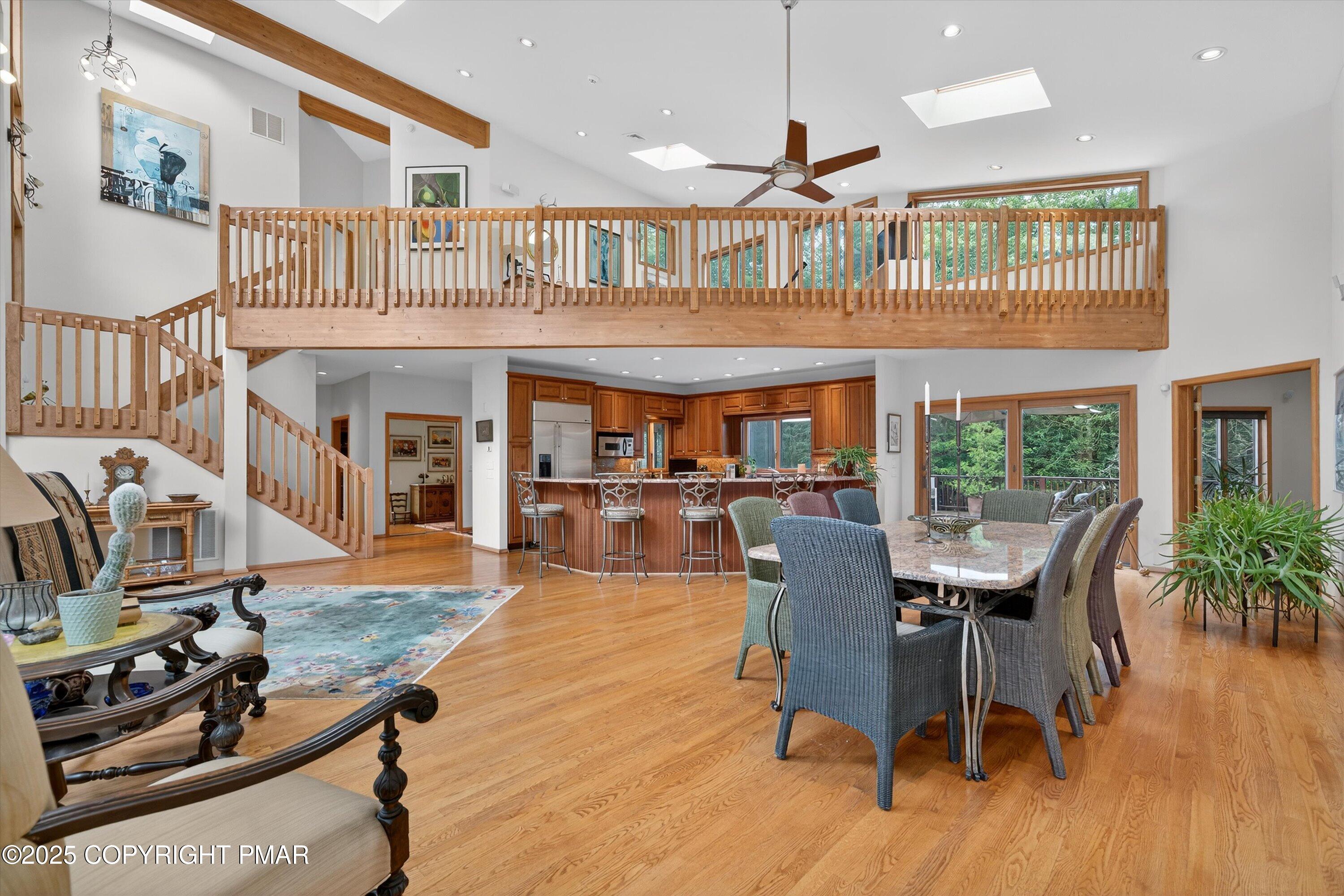 804 Ranch Court Hawley, PA 18428 - Photo 17 of 74 a dining room with furniture a floor to ceiling window and wooden floor