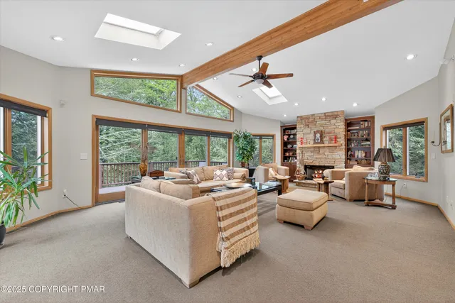 a spacious bedroom with a bed and a table