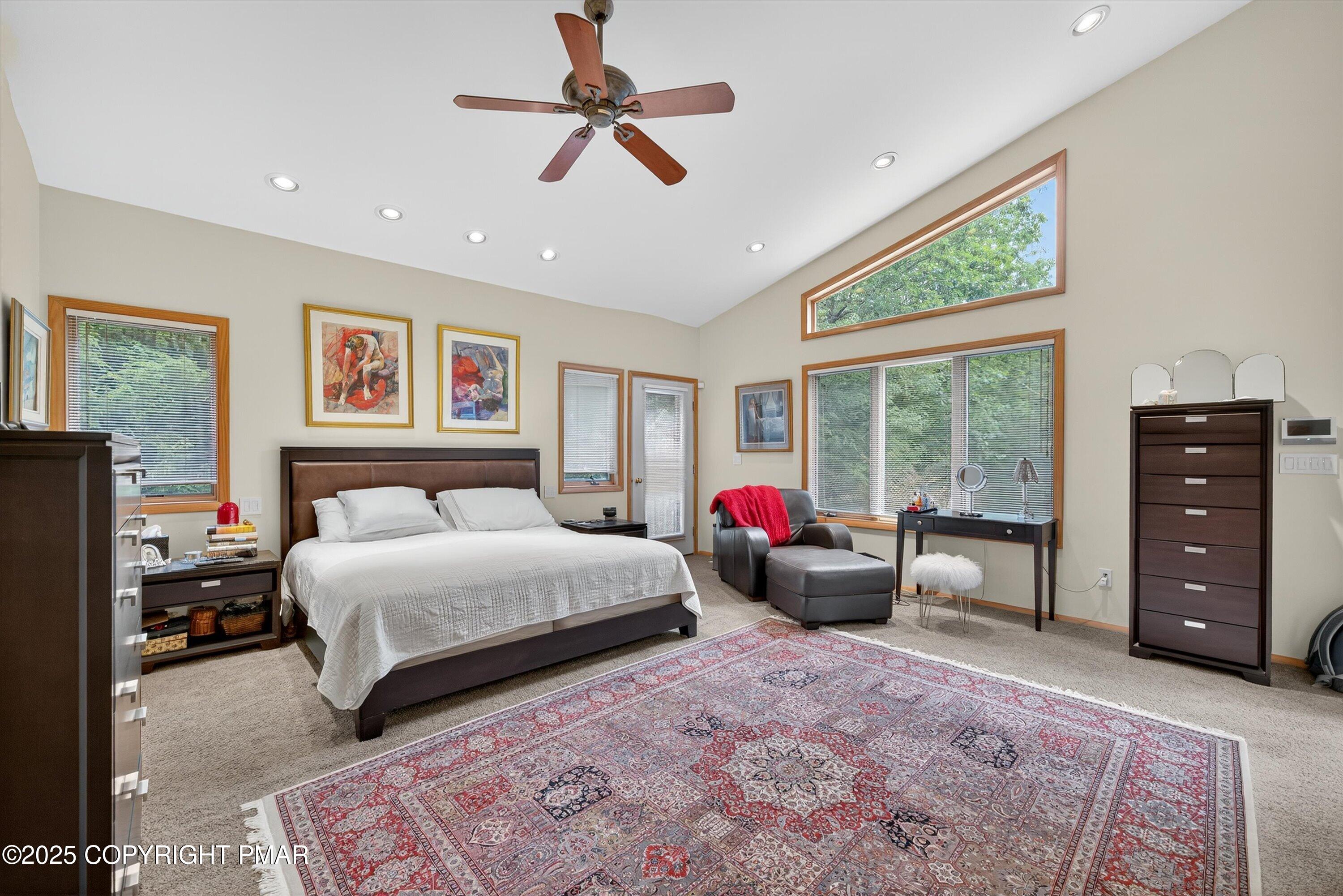 804 Ranch Court Hawley, PA 18428 - Photo 27 of 74 a spacious bedroom with a bed a couch and a window