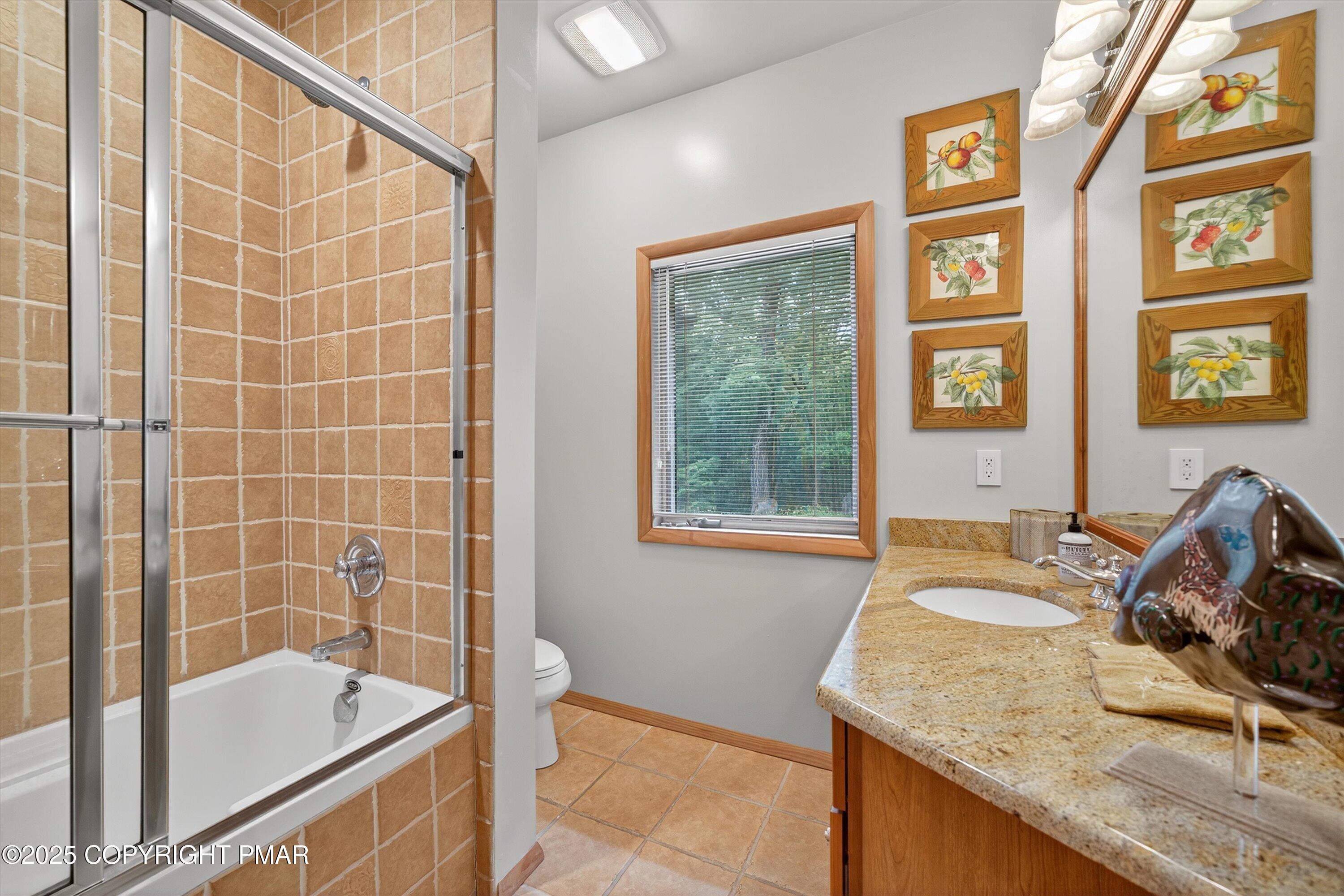 804 Ranch Court Hawley, PA 18428 - Photo 30 of 74 a bathroom with a granite countertop sink and a bathtub