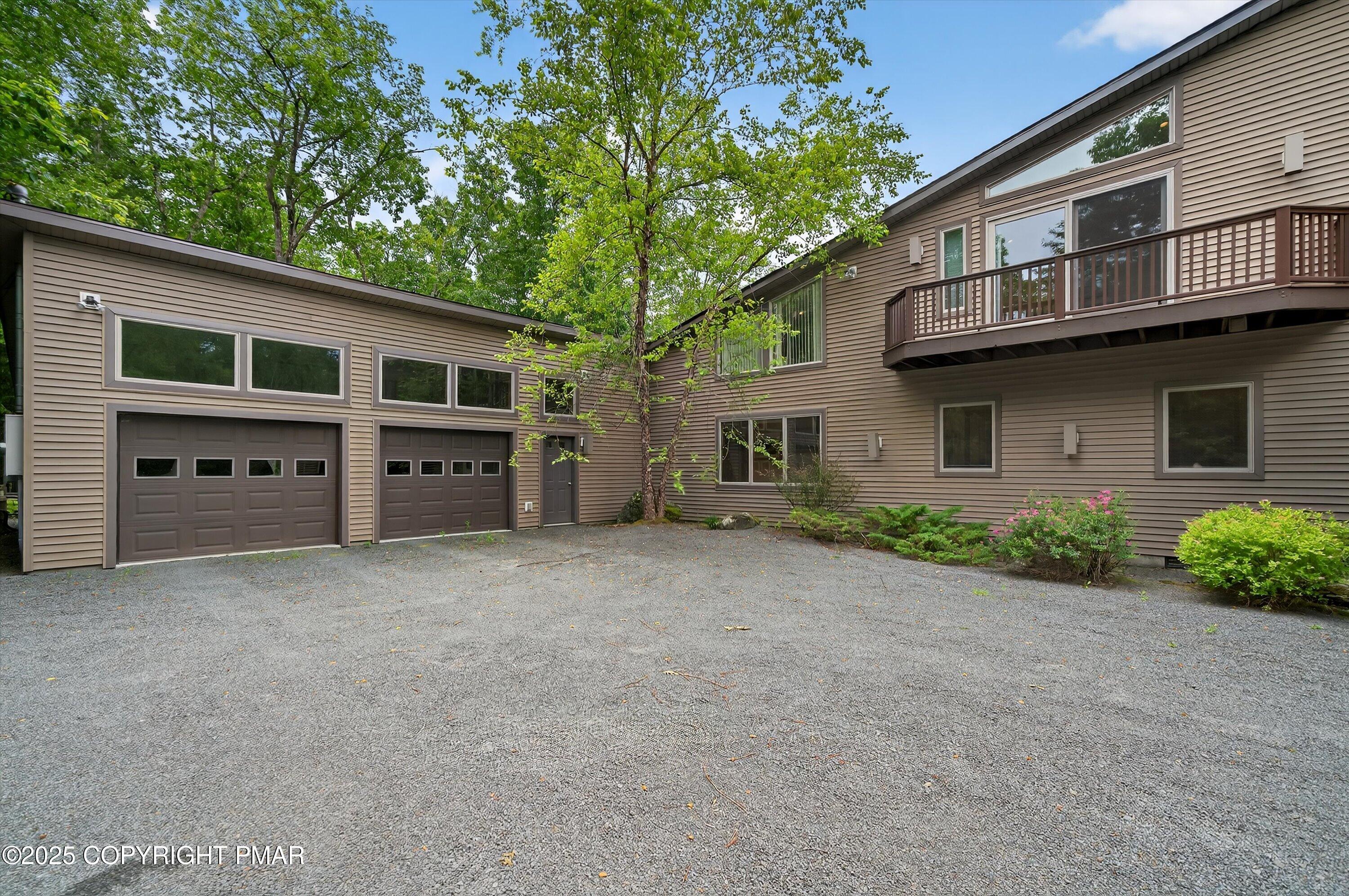 804 Ranch Court Hawley, PA 18428 - Photo 3 of 74 a front view of house with yard and trees in the background