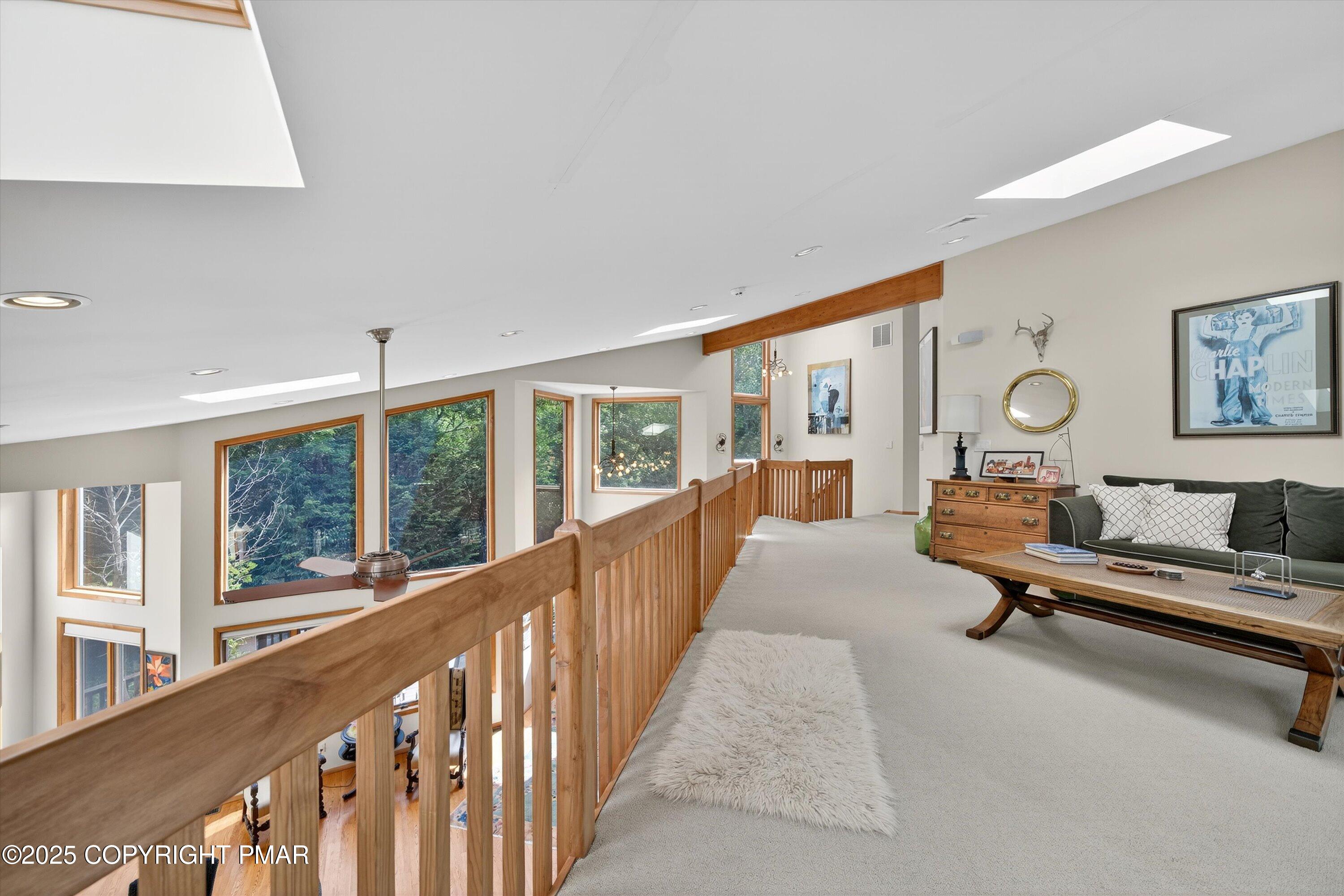 804 Ranch Court Hawley, PA 18428 - Photo 36 of 74 a living room with furniture gym equipment and a large window
