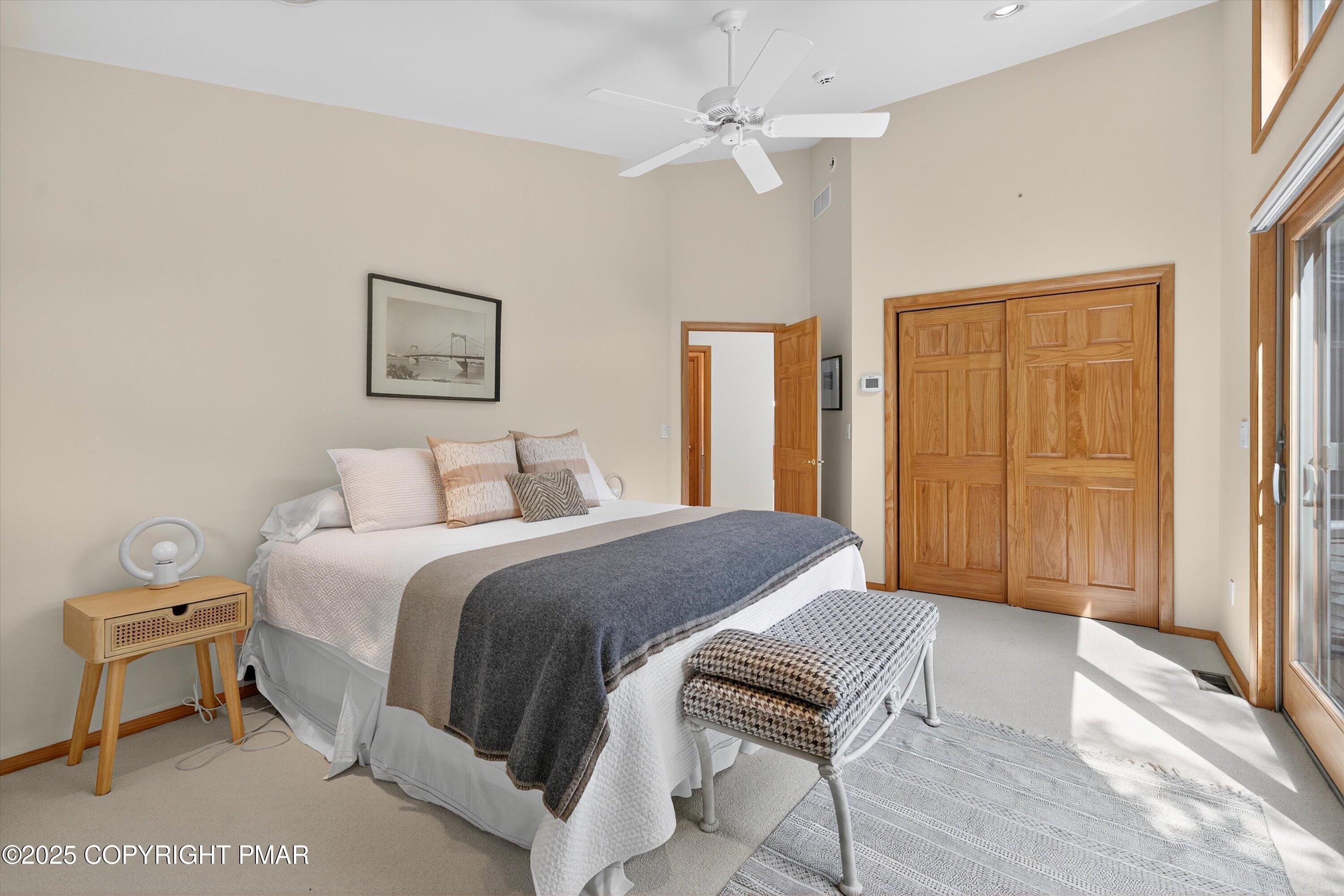 804 Ranch Court Hawley, PA 18428 - Photo 39 of 74 a spacious bedroom with a bed and a table