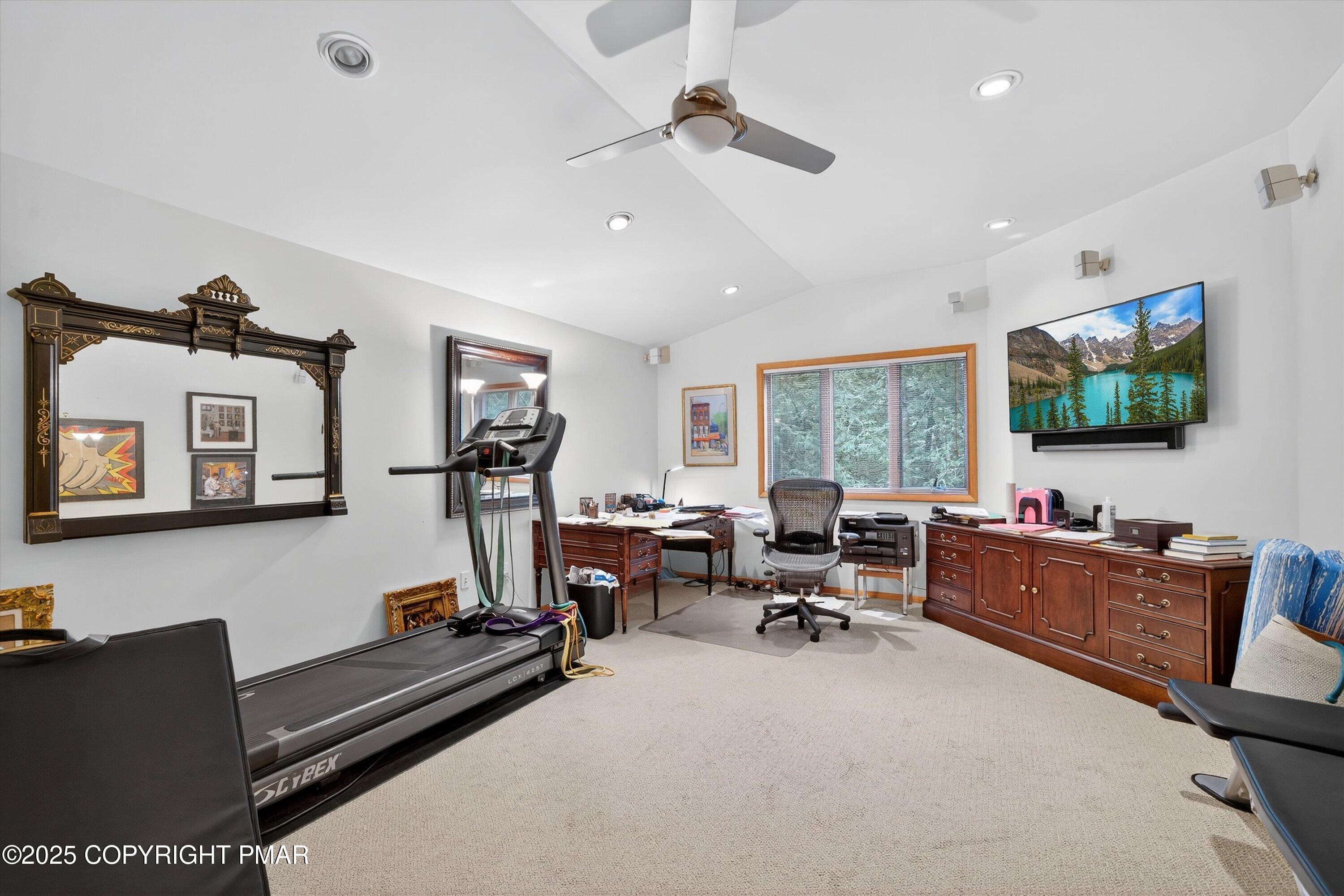 804 Ranch Court Hawley, PA 18428 - Photo 48 of 74 a living room with furniture gym equipment and a flat screen tv