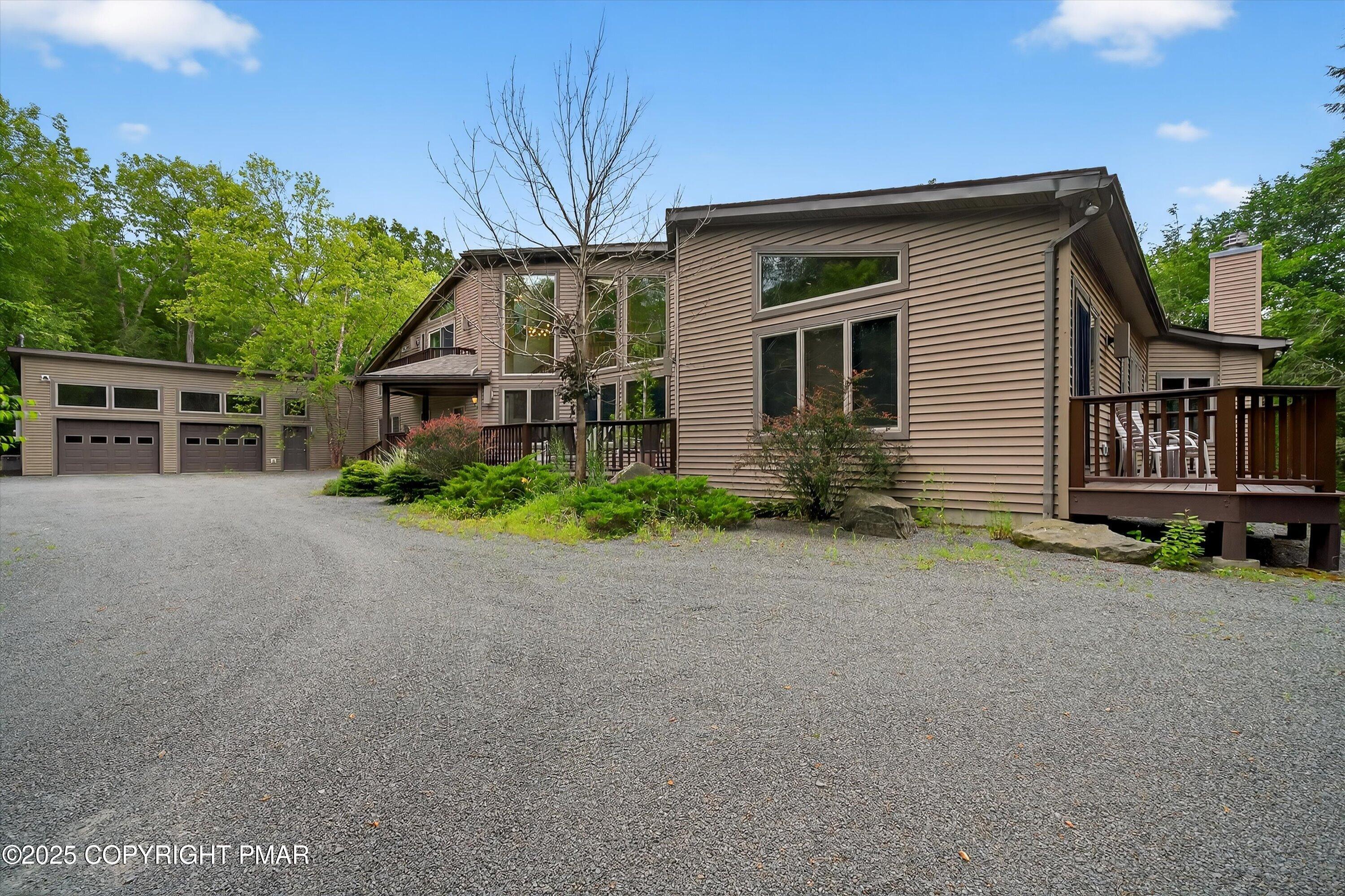 804 Ranch Court Hawley, PA 18428 - Photo 6 of 74 a view of a house with a yard and potted plants
