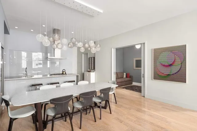 a bathroom with a granite countertop sink a mirror and a shower