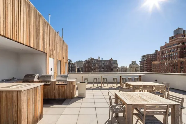 a view of a balcony with furniture