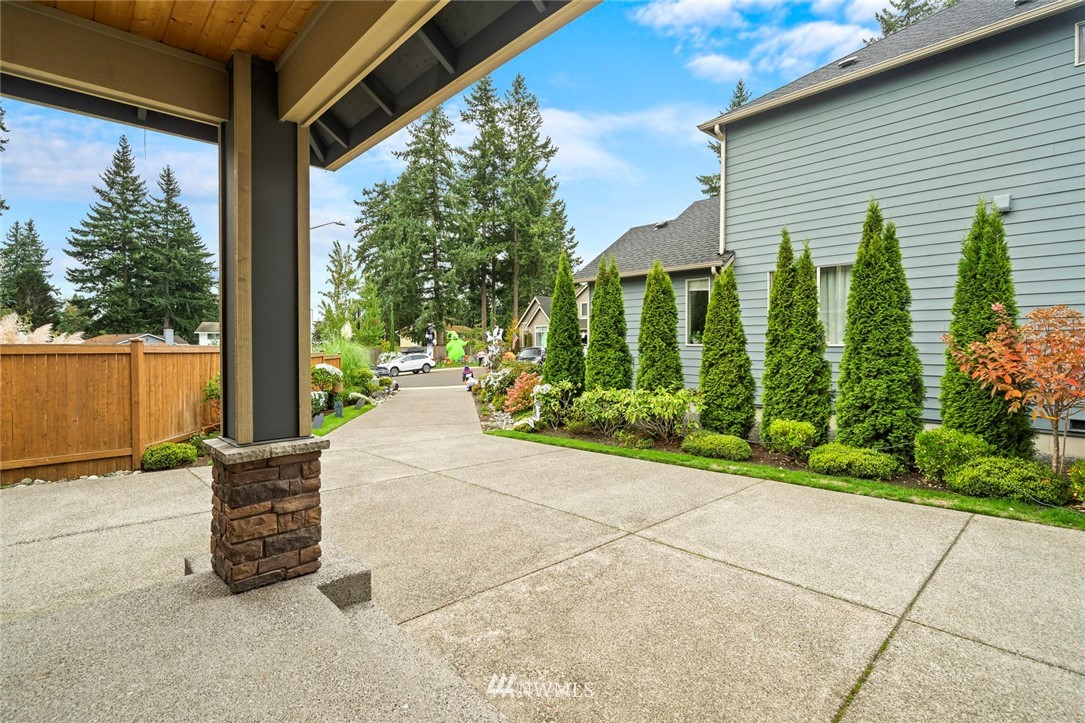 2313 242nd Place Southwest Bothell, WA 98021 - Photo 3 of 27 a view of backyard with outdoor seating and plants