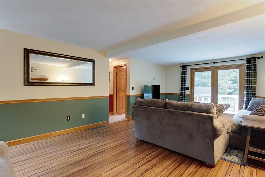 94 Haynes Road Townsend, MA 01469 - Photo 12 of 34 a living room with furniture and a large window