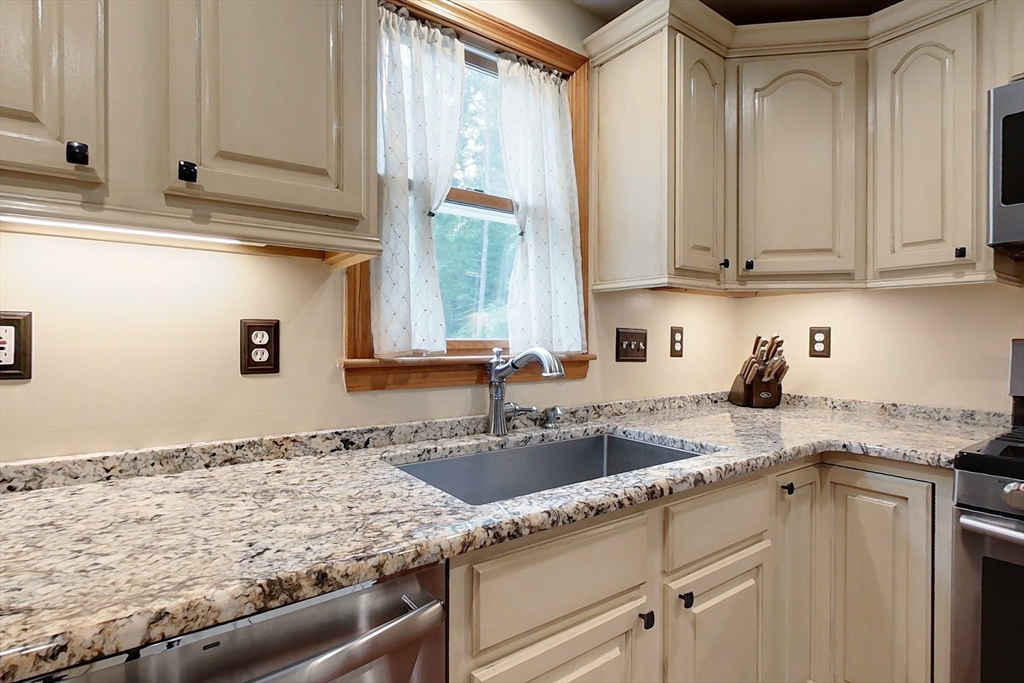 94 Haynes Road Townsend, MA 01469 - Photo 4 of 34 a kitchen with granite countertop a sink and a stove