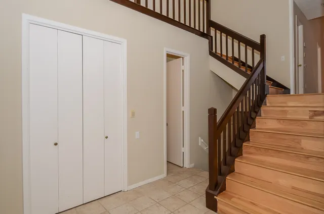 a view of an entryway with wooden floor