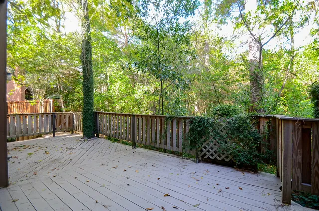 a balcony with wooden floor