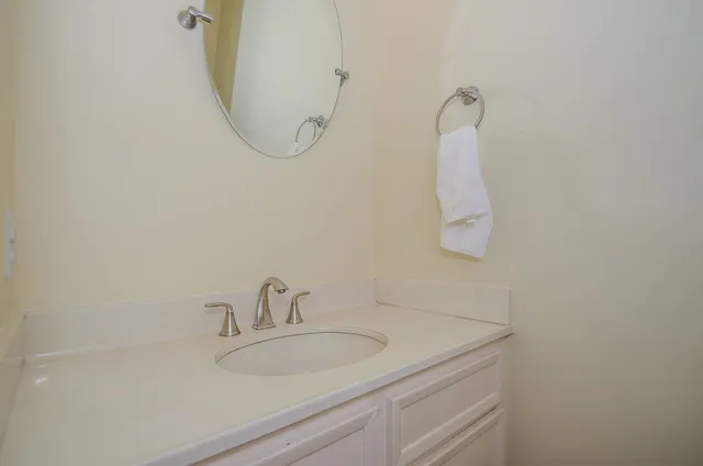 a bathroom with a sink and mirror
