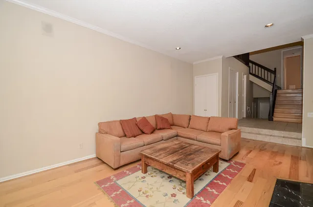 a living room with furniture and a rug