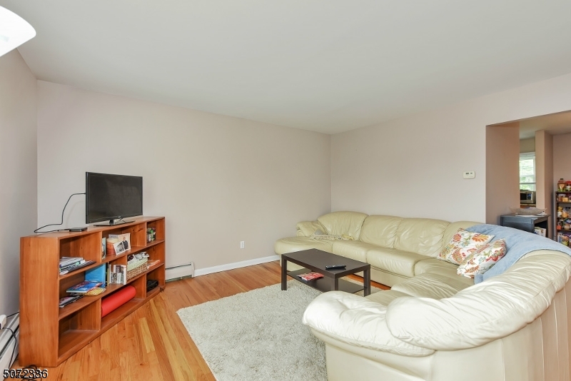 42 Walnut Street, Unit 1 Montclair, NJ 07042 - Photo 3 of 11 a living room with furniture and a flat screen tv