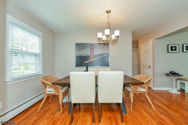 42 Walnut Street, Unit 1 Montclair, NJ 07042 - Photo 4 of 11 a view of a dining room with furniture wooden floor and chandelier