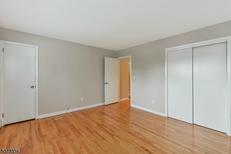 42 Walnut Street, Unit 1 Montclair, NJ 07042 - Photo 8 of 11 a view of an empty room with wooden floor