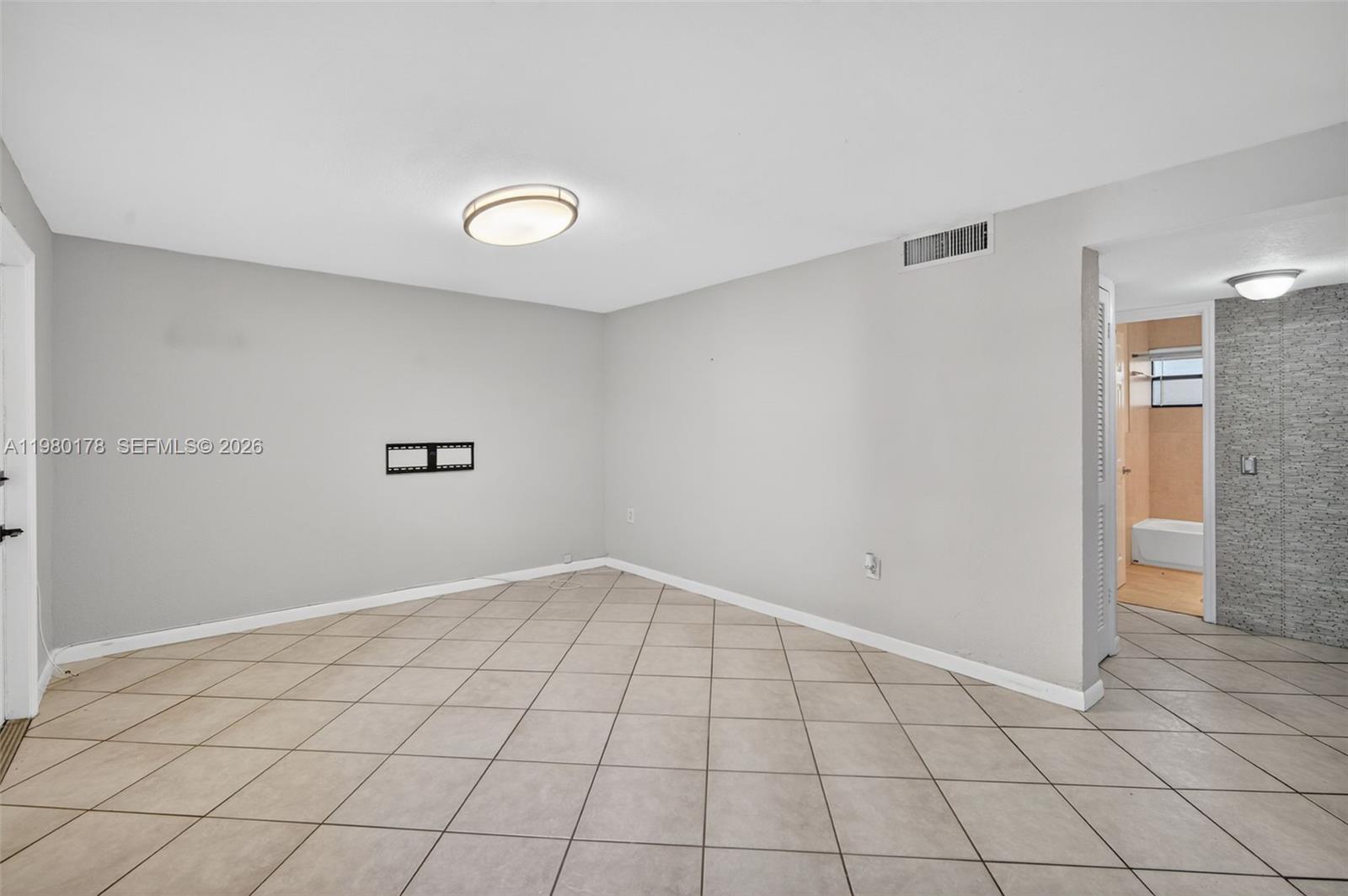 3265 Virginia Street, Unit 9 Miami, FL 33133 - Photo 12 of 32 a view of an empty room