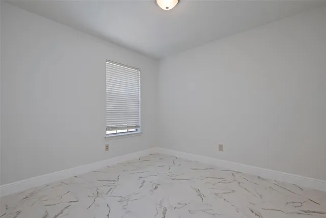 a view of backyard with wooden fence