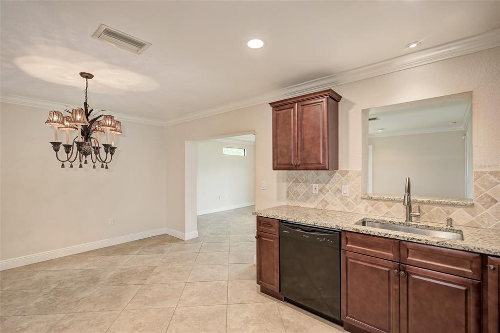 1330 Georgetowne Circle Sarasota, FL 34232 - Photo 16 of 46 a bathroom with a sink and a mirror