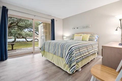 2003 North Fulton Beach Road, Unit 43 Rockport, TX 78382 - Photo 15 of 30 Condo has split plan with two secondary bedrooms and bath down the hall from the
family room. Large sliding doors lead to outside deck.