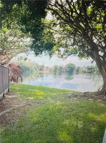 a view of an empty room and a window