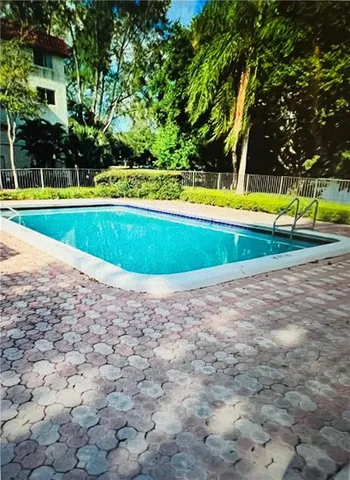 an outdoor space with lots of trees