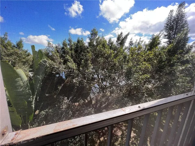 a spacious bathroom with a granite countertop sink a mirror and a shower