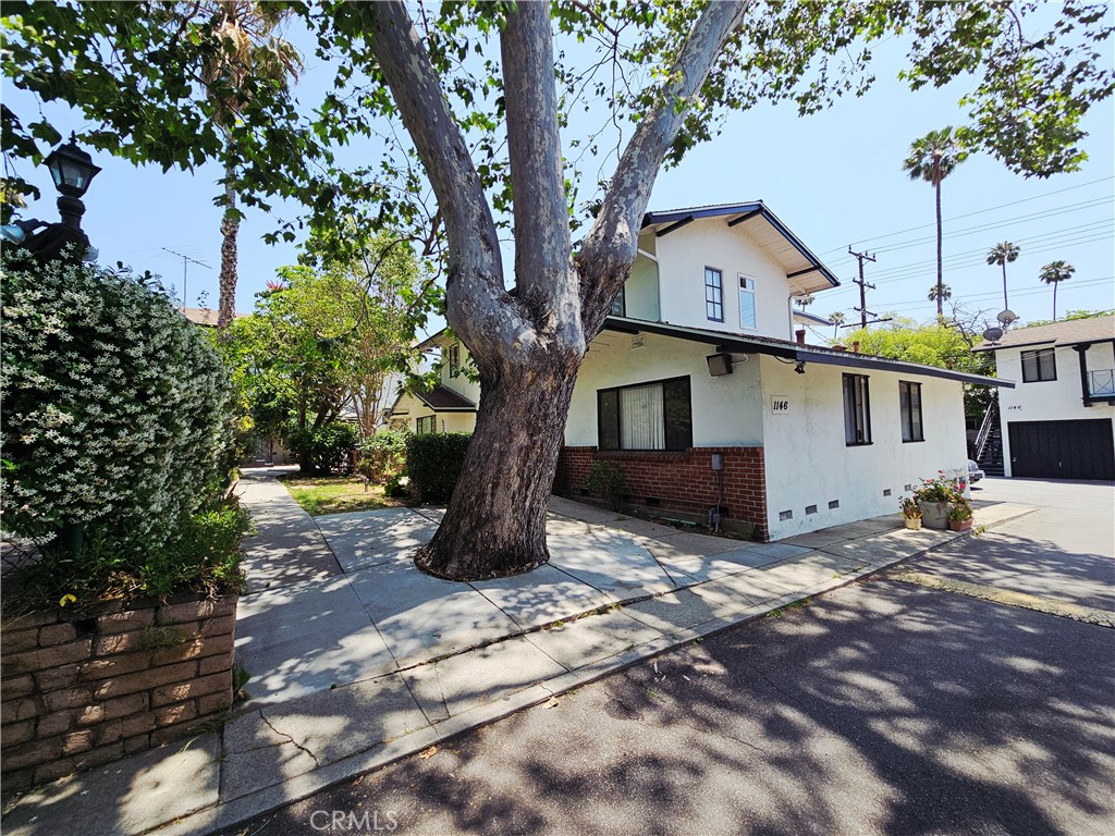 1142 Western Avenue Glendale, CA 91201 - Photo 1 of 23 a view of a house with a tree in the background