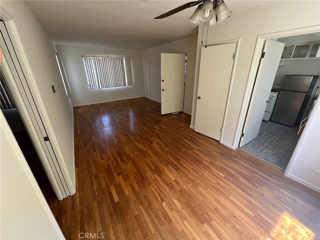 1142 Western Avenue Glendale, CA 91201 - Photo 18 of 23 an empty room with wooden floor and windows