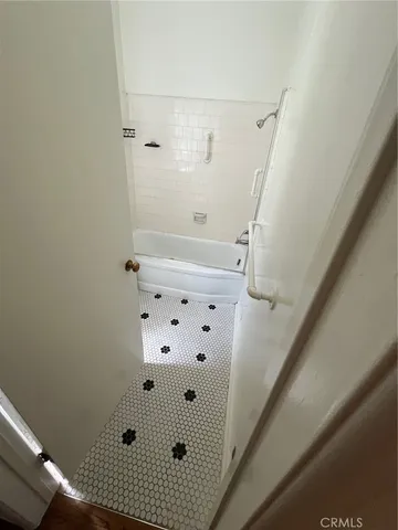 a bathroom with a bathtub and a sink