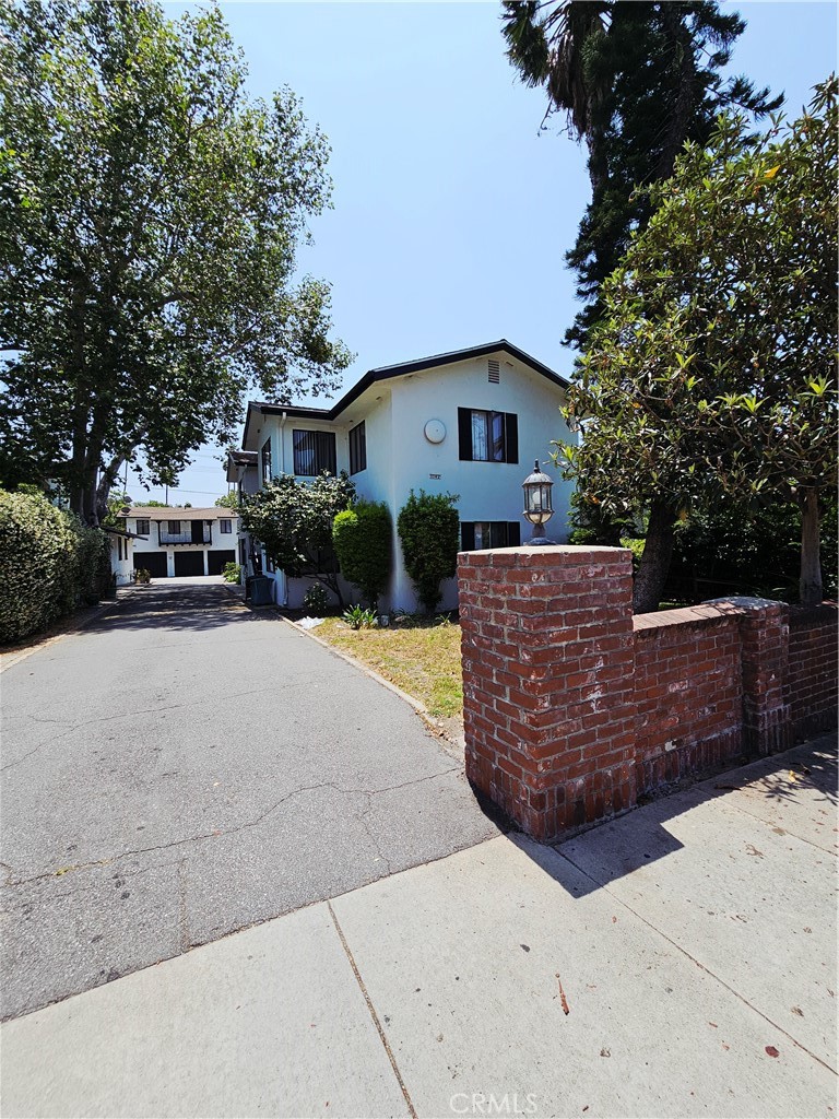 1142 Western Avenue Glendale, CA 91201 - Photo 3 of 23 a front view of a house with a yard