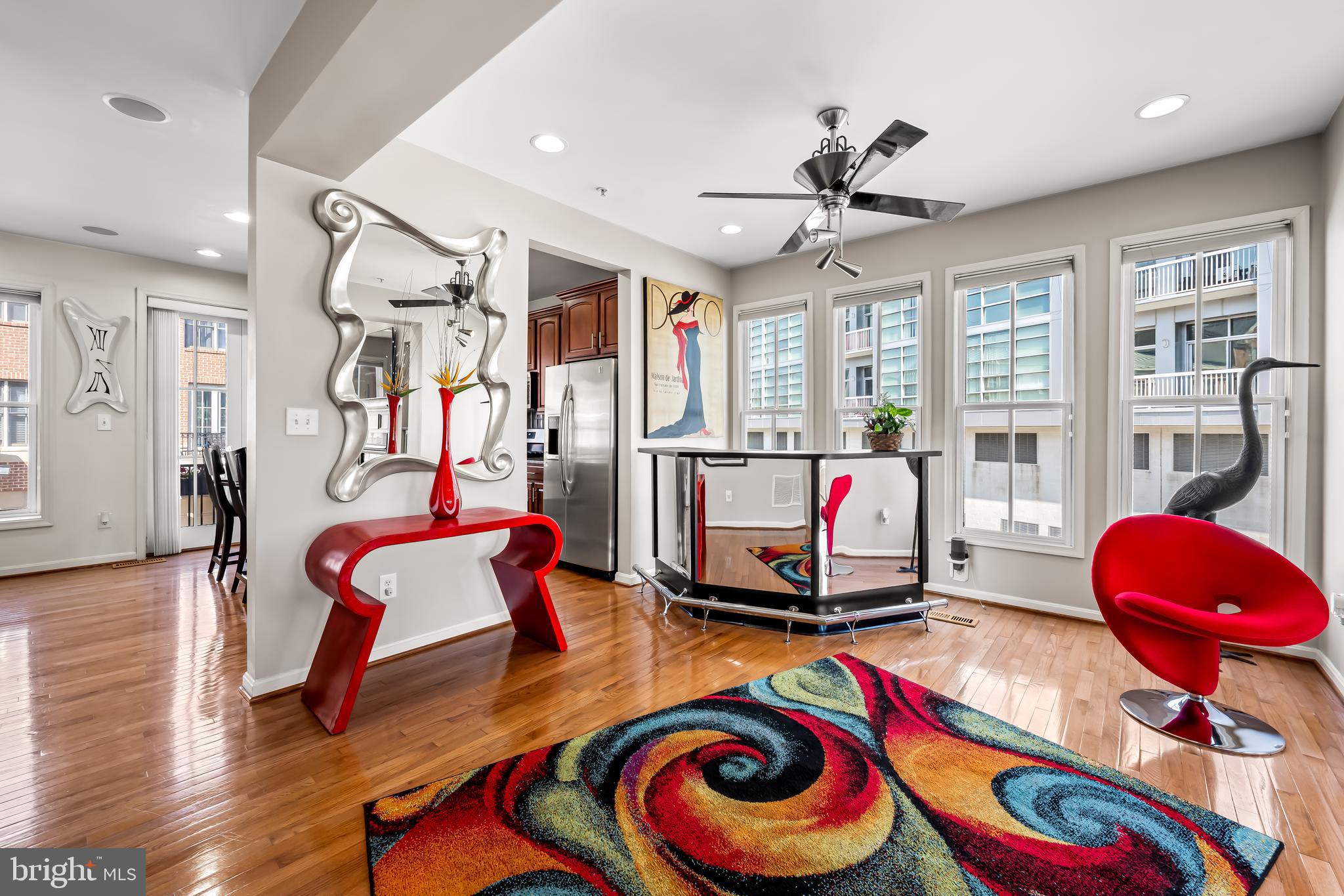 2618 Lighthouse Lane Baltimore, MD 21224 - Photo 11 of 60 a living room with furniture and a floor to ceiling window
