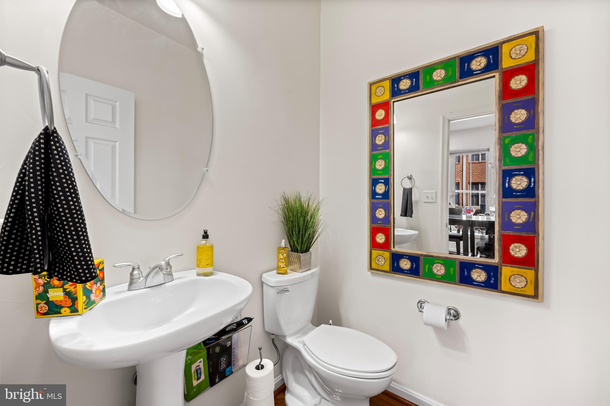 2618 Lighthouse Lane Baltimore, MD 21224 - Photo 20 of 60 a bathroom with a sink vanity mirror and toilet