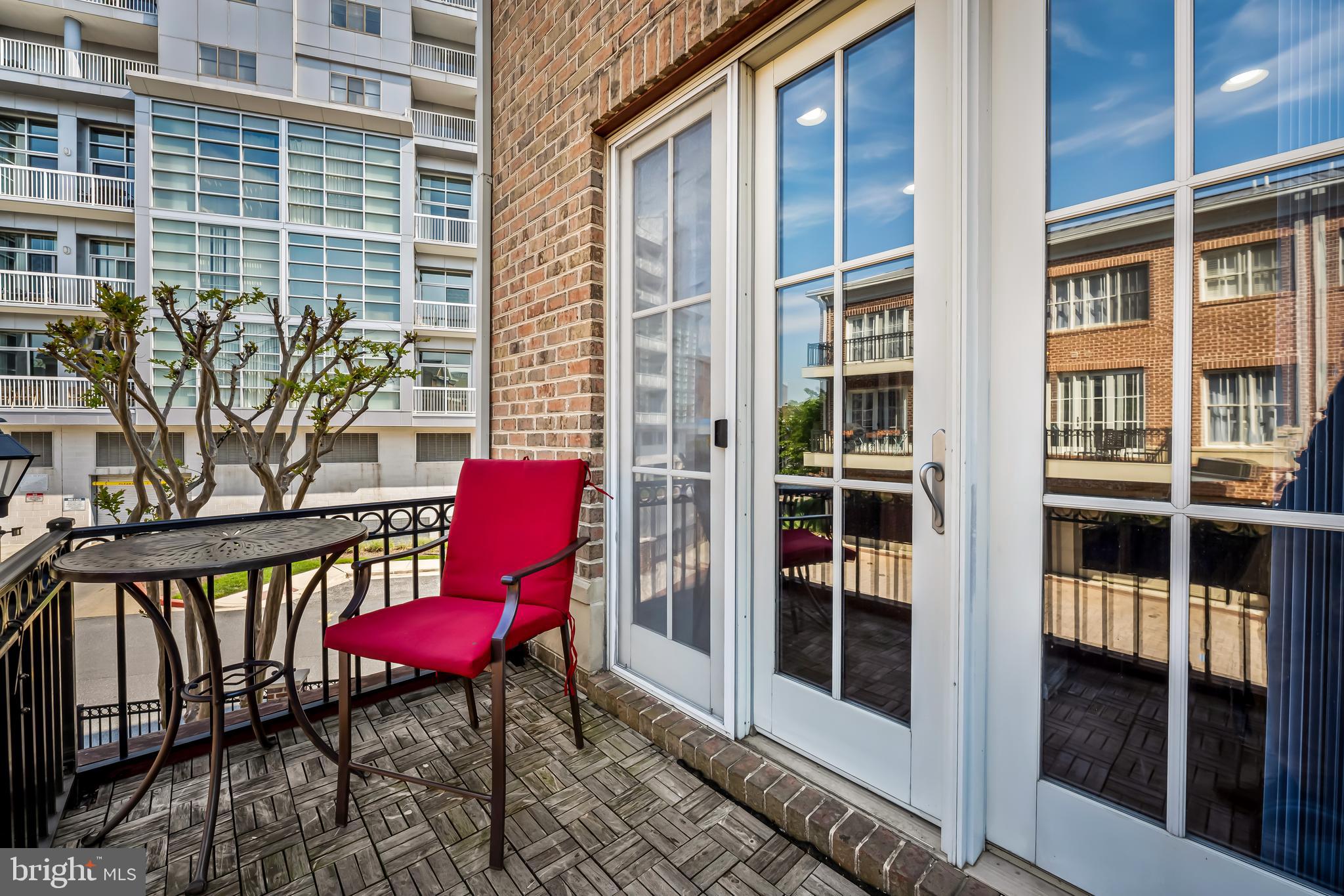 2618 Lighthouse Lane Baltimore, MD 21224 - Photo 21 of 60 a chair and table in the balcony