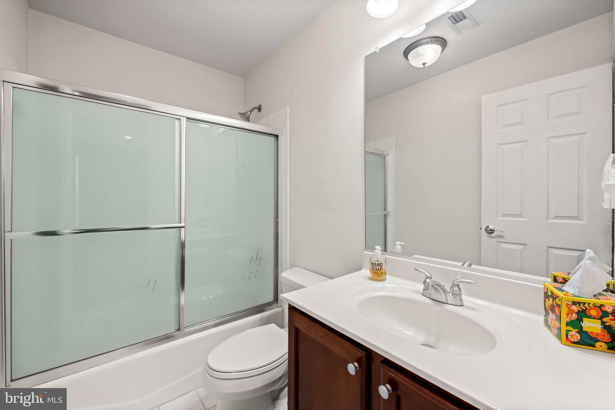 2618 Lighthouse Lane Baltimore, MD 21224 - Photo 30 of 60 a bathroom with a sink toilet and shower