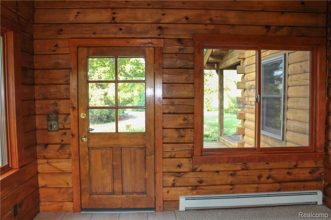 4165 Morgan Road Lake Orion, MI 48359 - Photo 45 of 81 Sun Room just off the dining room. Heat and Air and incredible views from all 3 sides.