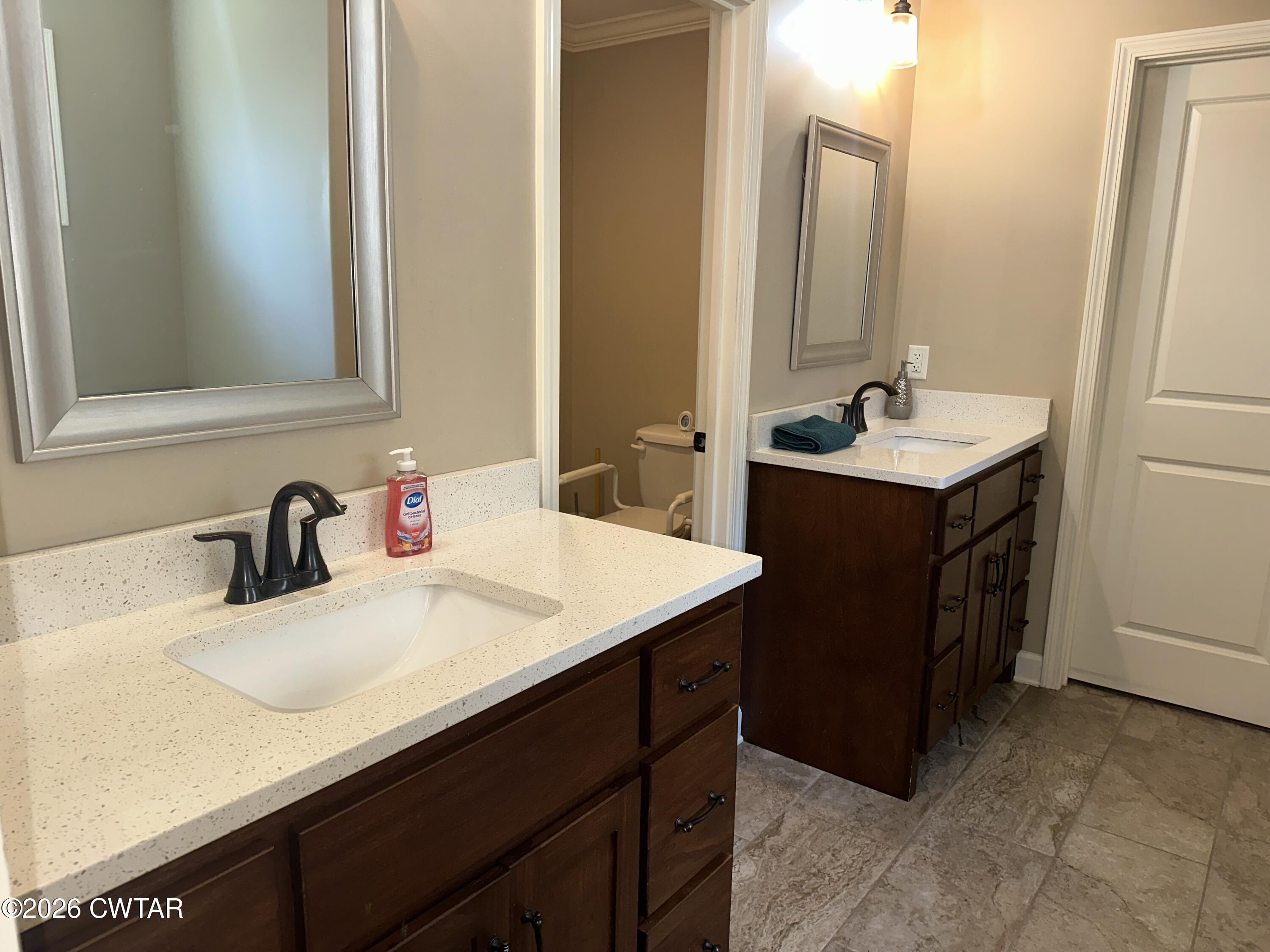 103 Gatewick Drive Jackson, TN 38305 - Photo 13 of 29 a bathroom with a sink and a mirror
