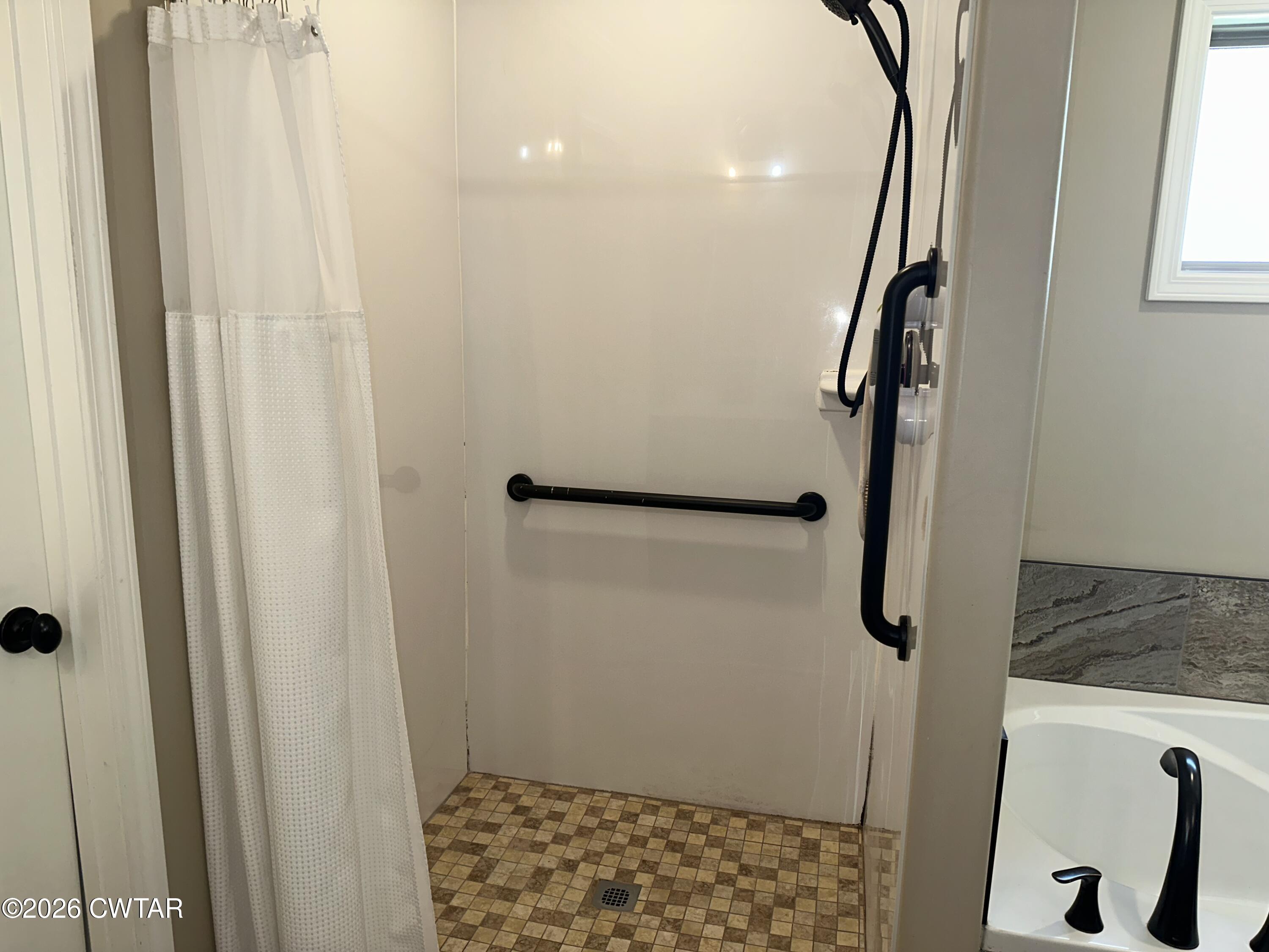 103 Gatewick Drive Jackson, TN 38305 - Photo 14 of 29 a bathroom with a granite countertop shower and a sink
