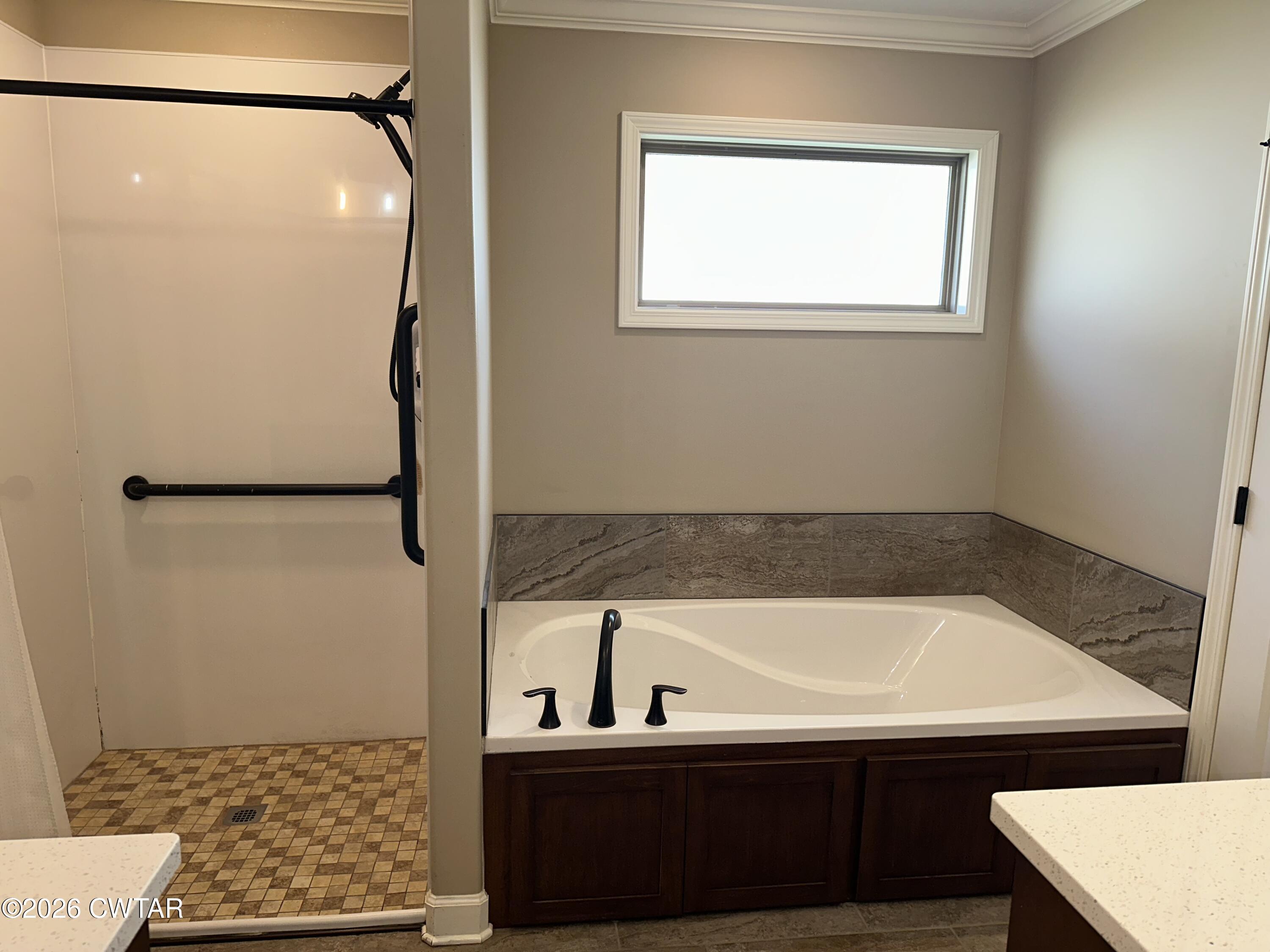 103 Gatewick Drive Jackson, TN 38305 - Photo 15 of 29 a bathroom with a sink and a shower